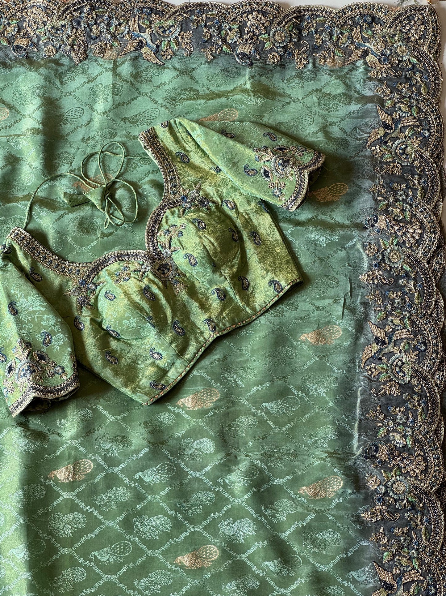 Leaf Green With Teal Blue Embroidered Border Zari Viscose Tissue Saree With Dusty Green Blouse